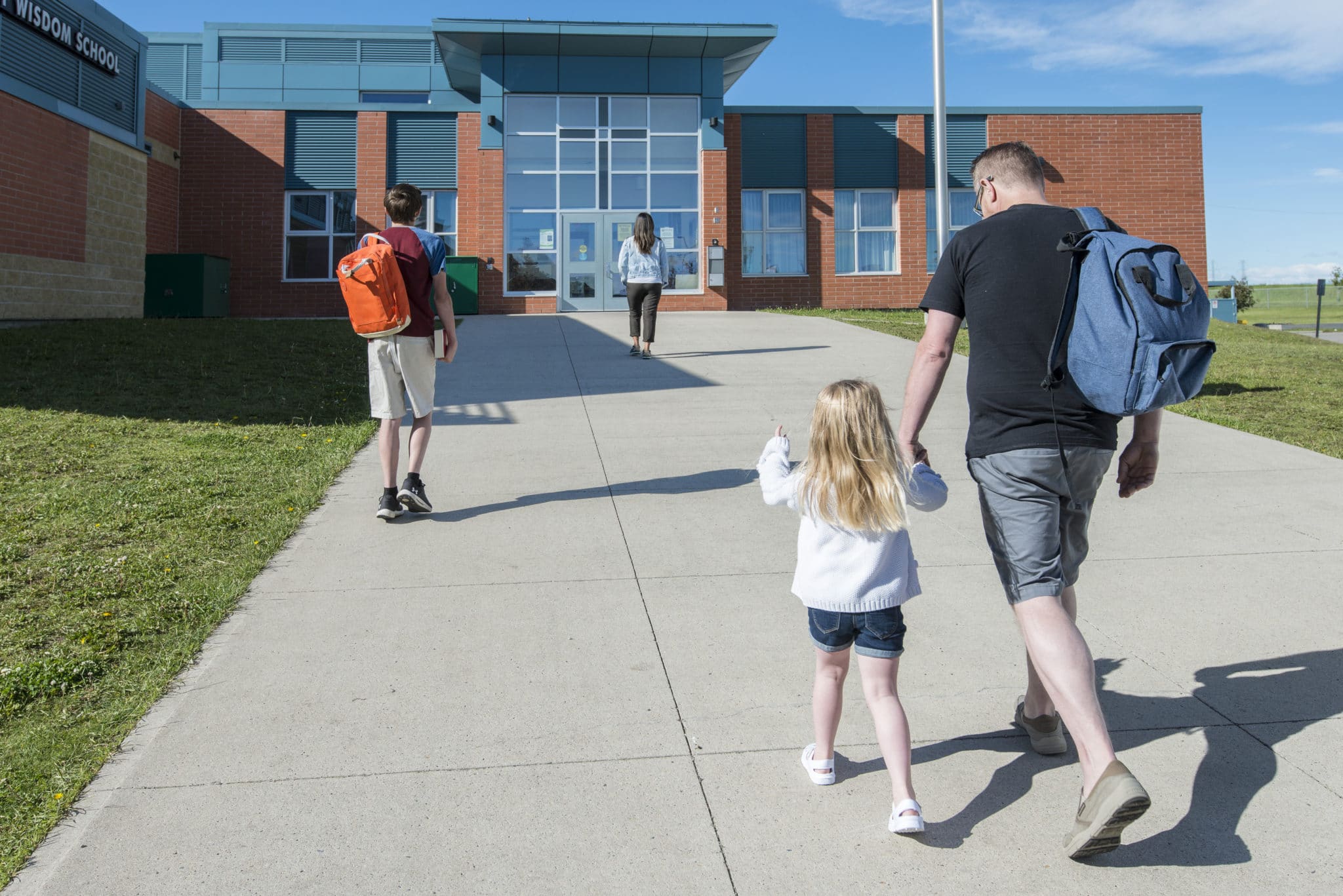 Man walking child to school